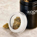 Large black glass jar with 5x magnifying lid for weed storage